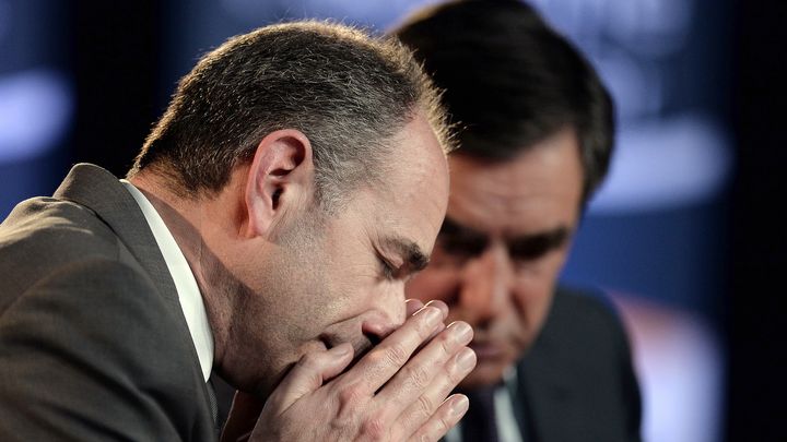 Jean-Francois Copé et François Fillon, lors d'un meeting à Strasbourg le 5 mars 2014. (FREDERICK FLORIN / AFP)