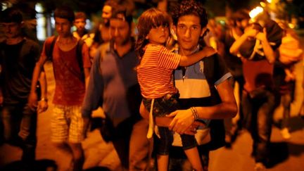 &nbsp; (Les migrants ont quitté la ville macédonienne de Gevgelija en train, en bus... © REUTERS / Ognen Teofilovski)