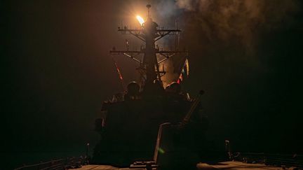 A US and British naval fleet ship in the Red Sea, January 12, 2024, in an image shared by the US Army Regional Command.  (US CENTRAL COMMAND / ANADOLU / AFP)