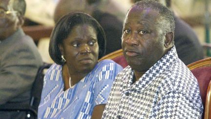 Simone&nbsp;et Laurent Gbagbo sont photographiés le 27 février 2005 à Bonoua, au sud d'Abidjan (la capitale économique de la Côte d'Ivoire), lors de l'inauguration d'une église méthodiste. (KAMBOU SIA / AFP)