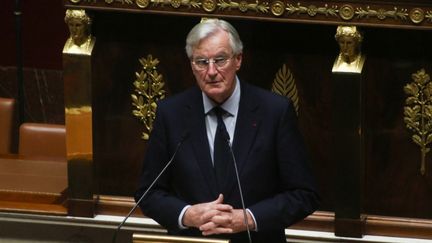 Le Premier ministre Michel Barnier annonce l'utilisation de l'article 49.3 de la Constitution, à l'Assemblée nationale, à Paris, le 2 décembre 2024. (QUENTIN DE GROEVE / HANS LUCAS / AFP)