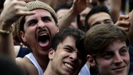 En Italie, où les jeunes sont particulièrement touchés par le chômage, le concert du 1er mai à Rome a pris des allures contestataires. (AFP PHOTO / Filippo MONTEFORTE)