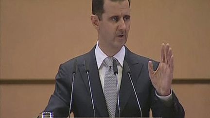 Le pr&eacute;sident syrien Bachar Al-Assad lors de son discours &agrave; l'universit&eacute; de Damas (Syrie), le 10 janvier 2012. (REUTERS TV)