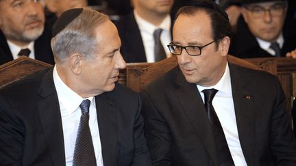 Le Premier ministre isra&eacute;lien, Benyamin N&eacute;tanyahou, et Fran&ccedil;ois Hollande &agrave; la grande synagogue de Paris, le 11 janvier 2015. (MATTHIEU ALEXANDRE / AFP)