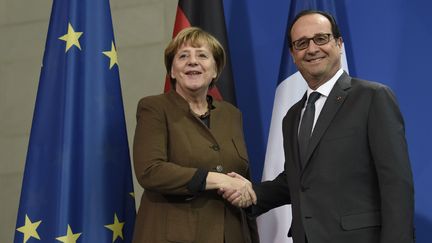 Angela Merkel et François Hollande, le 13 décembre 2016 à Berlin (ODD ANDERSEN / AFP)