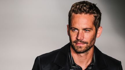 L'acteur Paul Walker lors d'un d&eacute;fil&eacute; &agrave;&nbsp;S&atilde;o Paulo (Br&eacute;sil) pour le cr&eacute;ateur&nbsp;Colcci, le 21 mars 2013. (WILLIAM VOLCOV / BRAZIL PHOTO PRESS / AFP)