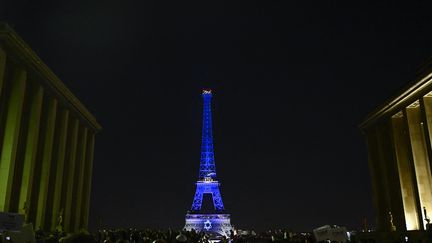 The Eiffel Tower illuminated in Israeli colors, October 9, 2023, in Paris.  (JULIEN DE ROSA / AFP)