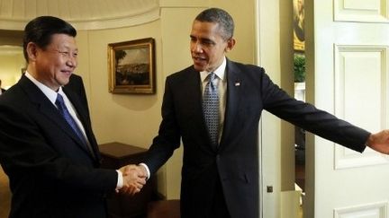 Le vice-président chinois Xi Jinping et le président américain Barack Obama, le 14 février 2012 à la Maison Blanche, à Washington. (AFP PHOTO/XINHUA/LAN HONGGUANG)