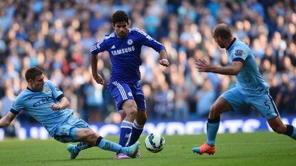 Manchester City et Chelsea se livrent un gros duel (CARL COURT / AFP)