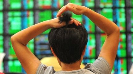 Les marchés asiatiques accusaient de fortes baisses lundi. (PATRICK LIN / AFP)