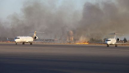 &nbsp; (Des avions sur l'aéroport de Tripoli alors que les combats font rage entre miliciens rivaux et islamistes. © REUTERS/Hani Amara)