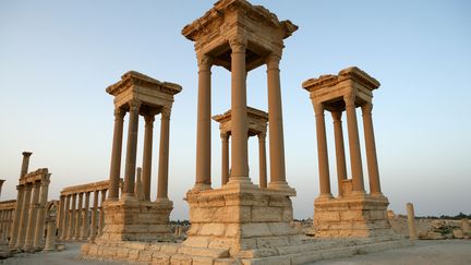 he Tetrapylon (Monumental Entrance). Reconstructed after 1963 by the Directorate of Antiquities of Syria. Four "podia" were built under a square foundation, each supporting four columns originally made of pink granite. Each construction contained a statue. View with the Great Colonnade in the distance. Palmyra. Syria Picture by Manuel Cohen (MANUEL COHEN / AFP )