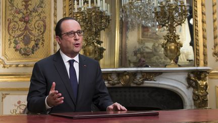  (François Hollande, dans son bureau de l'Elysée, lors de ses vœux de décembre 2014 © Reuters)