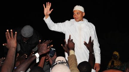 L'ancien ministre s&eacute;n&eacute;galais Karim Wade, le 20 d&eacute;cembre 2012, &agrave; Colobane, un quartier de Dakar. (SEYLLOU / AFP)