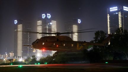 An Israeli helicopter with freed hostages on board prepares to land near the Schneider Medical Center in Tel Aviv, November 24, 2023. (JACK GUEZ / AFP)