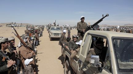 Supporters of the Houthi rebels parade with weapons on January 22, 2024, in Sanaa, Yemen.  (MOHAMMED HAMOUD / ANADOLU / AFP)