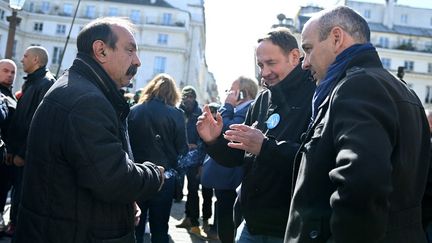 Les leaders de la CGT et de la CFDT, Philippe Martinez et Laurent Berger, à Paris, le 16 mars 2023. (ALAIN JOCARD / AFP)