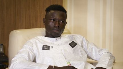 Mamoudou Gassama lors de sa réception à Bamako par le président malien, le 18 juin 2018. (MICHELE CATTANI / AFP)