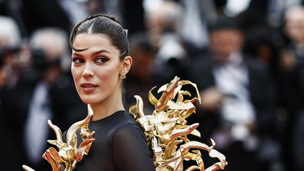 Former Miss France and former Miss Universe, Iris Mittenaere, during the 77th edition of the Cannes Film Festival, May 15, 2024 (SAMEER AL-DOUMY / AFP)