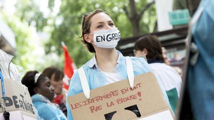 &nbsp; (Une infirmière gréviste lors de la manifestation du 21 mai © Maxppp)