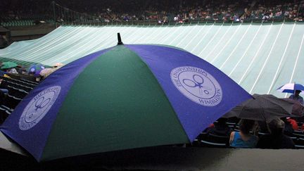 En raison de la crise du coronavirus, le tournoi de Wimbledon a été annulé. Ici, une photo montrant une suspension de match en raison de la pluie. (SVEN SIMON / SVEN SIMON)