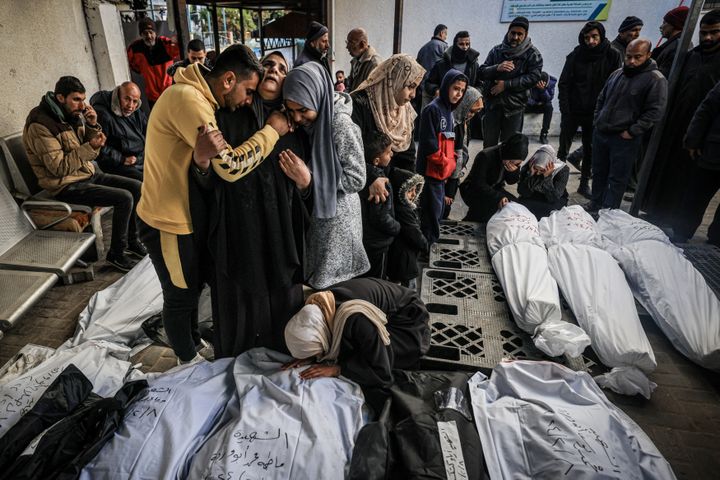 Palestinians mourn their loved ones killed in a bombing in Rafah, in the Gaza Strip, February 8, 2024. (MAHMUD HAMS / AFP)