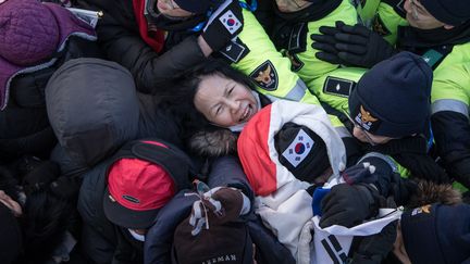 Manifestation contre 120 artistes nord-coréens venus se produire pour les JO 
 (Ed JONES / AFP)