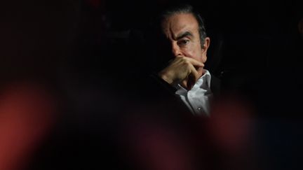 Carlos Ghosn quitte le bureau des procureurs en voiture, à Tokyo (Japon), le 6 mars 2019. (KENTRARO AOYAMA / YOMIURI / AFP)