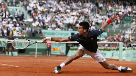 Djokovic ne lâche rien pour gagner son premier titre à Roland-Garros (KENZO TRIBOUILLARD / AFP)