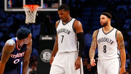 Pour Deron Williams et Joe Johnson (à droite), la saison est terminée  (JIM MCISAAC / GETTY IMAGES NORTH AMERICA)