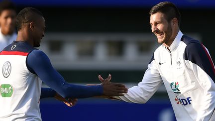 Patrice Evra et André-Pierre Gignac, cette semaine à l'entraînement (FRANCK FIFE / AFP)