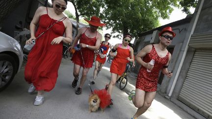 Des coureurs participent &agrave; une course caritative en faveur de la Croix-Rouge &agrave; p&eacute;kin (Chine), le 12 mai 2013. (JASON LEE / REUTERS)