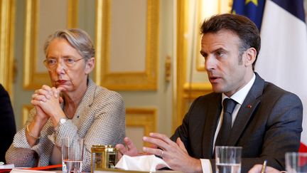 Elisabeth Borne and Emmanuel Macron during a meeting on pension reform at the Elysee Palace in Paris on April 18, 2023. (STEPHANIE LECOCQ / AFP)