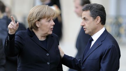 La chanceli&egrave;re allemande Angela Merkel et le pr&eacute;sident fran&ccedil;ais Nicolas Sarkozy, le 5 d&eacute;cembre 2011 &agrave; Paris. (ERIC FEFERBERG / AFP)