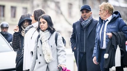 Indo-Swiss billionaire family members Namrata Hinduja (left) and Ajay Hinduja (second right) arrive at a court in Geneva, Switzerland, on January 15, 2024, for the opening day of a human trafficking trial.  (Gabriel Monet/AFP)