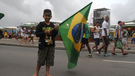 &nbsp; (Un enfant sur la plage de Copacabana le lendemain de l'élimination du Brésil © RF/GA)