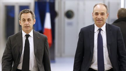 Nicolas Sarkozy et Jean-Fran&ccedil;ois Cop&eacute; quitte le si&egrave;ge de l'UMP, le 3 d&eacute;cembre 2014, apr&egrave;s un meeting.&nbsp; (THOMAS SAMSON / AFP)