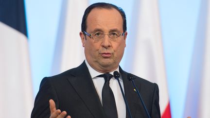 Fran&ccedil;ois Hollande, lors d'une conf&eacute;rence de presse, le 6 mars 2013 &agrave; Varsovie (Pologne). (BERTRAND LANGLOIS / AFP)