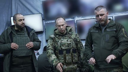 The new commander-in-chief of the Ukrainian army, Oleksandr Sirsky (center) visits frontline areas in eastern Ukraine on February 14, 2024.  (Armed Forces of Ukraine / AFP)