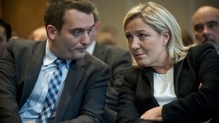 Florian Philippot et Marine Le Pen, respectivement vice-pr&eacute;sident et pr&eacute;sidente du Front national, le 10 d&eacute;cembre 2014 &agrave; Paris. (NICOLAS MESSYASZ/SIPA)