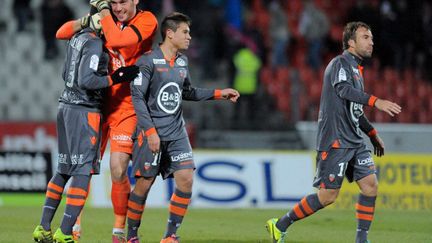 La joie des Lorientais après leur victoire à Evian (JEAN-PIERRE CLATOT / AFP)