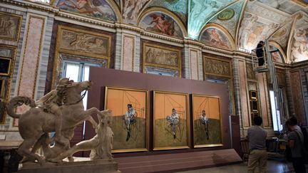 "Trois études de Lucian Freud", un triptyque de Francis Bacon, est acquis en novembre 2013 pour 142,4 millions de dollars, chez Christie's à New York. (VINCENZO PINTO / AFP)