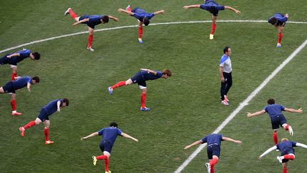 Les joueurs sud-cor&eacute;ens &agrave; l'entra&icirc;nement &agrave; Sao Paulo, le 25 juin 2014. (MARTIN BUREAU / AFP)