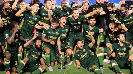 Les Timbers de Portland célèbrent leur victoire face à Orlando City (2-1) dans le dernier match du tournoi "MLS Is Back" au complexe ESPN Wide World of Sports le 11 août 2020, en Floride.  (SAM GREENWOOD / GETTY IMAGES NORTH AMERICA)