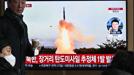 A man watches a report on North Korea's missile launch on December 18, 2023, at a subway station in Seoul, South Korea.  (ANTHONY WALLACE / AFP)