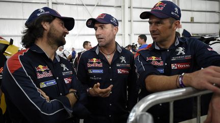 Stéphane Peterhansel et Cyril Despres refont le monde du Dakar avec David Castera (FRANCK FIFE / AFP)