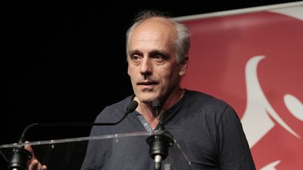 Le candidat du Nouveau parti anticapitaliste Philippe Poutou le 19 avril 2017 à Paris. (FRANÇOIS LOOCK / AFP)