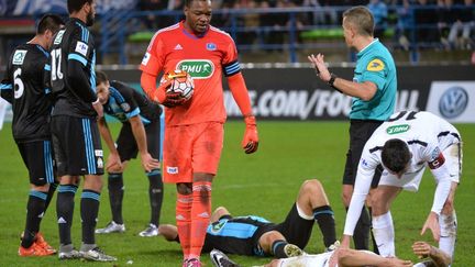 Pendant longtemps, le gardien et capitaine de l'OM, Steve Mandanda, a écœuré les attaquants normands. (JEAN-FRANCOIS MONIER / AFP)