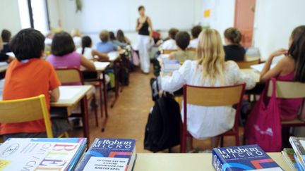 Des &eacute;l&egrave;ves d'une &eacute;cole primaire &agrave; Marseille (Bouches-du-Rh&ocirc;ne), en 2009. (ANNE-CHRISTINE POUJOULAT / AFP)