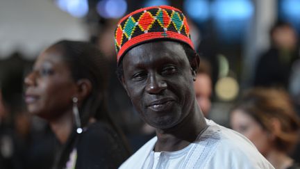 Le réalisateur sénégalais Moussa Touré arrivant, le 21 mai 2012, à la projection du film "Like Someone in Love", en compétition, lors de 65e édition du Festival de Cannes.&nbsp; (ALBERTO PIZZOLI / AFP)